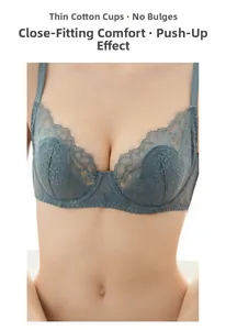 Detail of grey-blue lace bra featuring floral embroidery and gathered lifting design