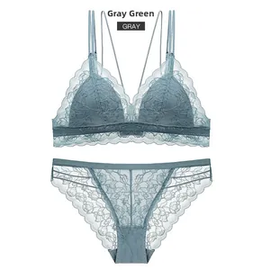 Detail view of gray green lace lingerie set featuring triangle cups and strappy panties