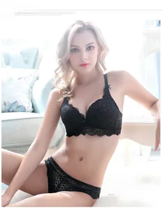 Detailed view of floral lace embroidery and scalloped edges on black lingerie set