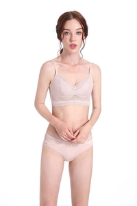 Detailed view of pink lace triangle cup bra and matching briefs set with sheer mesh texture