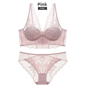 Detail of dusty rose floral lace lingerie set featuring embroidered bra and panties