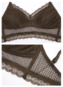 Detail of dark olive green lace bralette with triangle cups and delicate wavy edges