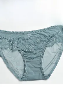Detailed view of Morandi blue lace panties with sheer mesh and floral embroidery