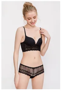 Detail of black lace deep V push-up wireless bra and matching seamless panty set