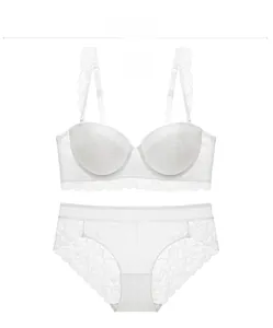 Flat lay of a white floral lace lingerie set with push-up bra and matching panties