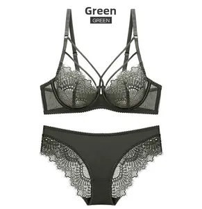 Detail of dark green lace lingerie set with floral embroidery and crossover strap design