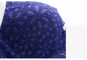 Close-up detail of dark blue floral embroidery lace and intricate hollow-out bra patterns