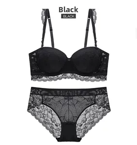 Flat lay detail of black floral lace lingerie set with 1/2 cup bra and matching panties