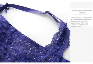 Detail of dark blue lace bra with adjustable straps, satin bow, and lifting effect