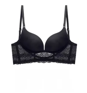 Detail shot of black seamless U-back bra featuring exquisite floral lace on side wings