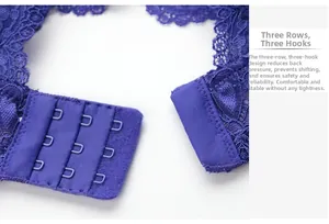Detail of blue lace bra featuring a three-row hook and eye closure for secure comfort