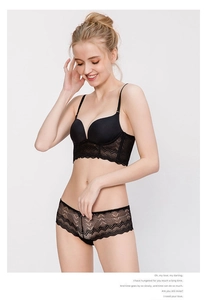 Detail of elegant black longline lace bra with seamless cups and matching lace panty set