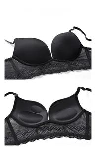 Detail of black seamless bra with wide floral lace trim and molded removable pads