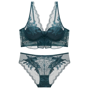 Deep green lace lingerie set with floral embroidery and sheer mesh on white background