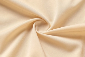Macro shot of breathable seamless beige fabric with micro-mesh texture for comfort