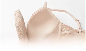 Detail of beige wireless lace bra showing soft inner cup texture and wavy lace trim