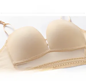 Detail of beige backless bra featuring breathable mesh fabric and delicate lace trim