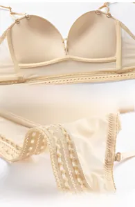 Detail of nude push-up bra featuring breathable mesh wings and lace polka dot trim