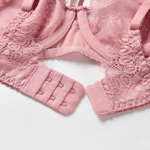 Pink lace underwire bra with three-row hook closure and intricate floral patterns