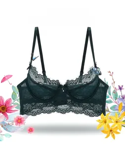 Détail d'un soutien-gorge en dentelle vert foncé avec bords en dentelle et papillons