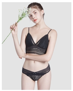 Detail of elegant black eyelash lace lingerie set with V-neck bra and matching panties