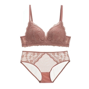 Detailed flat lay of a French lace wireless bra and panty set in dusky rose pink