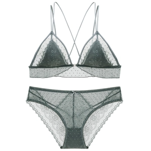 Detail of grey-green lace lingerie set with floral embroidery and mesh texture