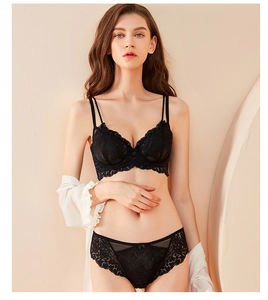 Detailed close-up of intricate plant pattern lace on this black lingerie set for women
