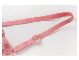 Close-up of pink adjustable elastic shoulder strap with mesh lace detail on bra