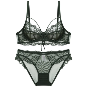 Deep green lace lingerie set featuring a sheer floral bra with ribbon and matching panty