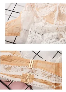 Close-up of white floral lace fabric and premium gold metal front closure on the bra