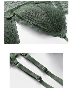 Close-up of dark green floral lace bra showing scalloped edges and metal strap sliders
