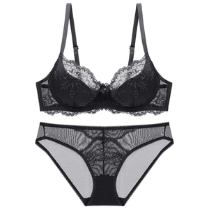 Sexy black floral lace lingerie set with underwire bra and matching mesh panties on white background