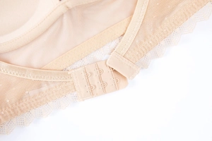 Detailed macro view of U-shaped back closure with adjustable three-row metal hooks and lace