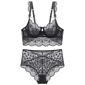 Sexy black lace lingerie set with underwire bra and high-waist panties on white background