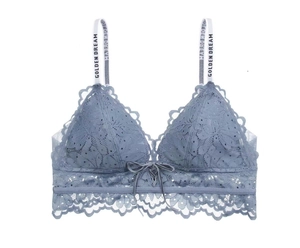 Dettaglio reggiseno in pizzo grigio-blu con spalline con scritta GOLDEN DREAM