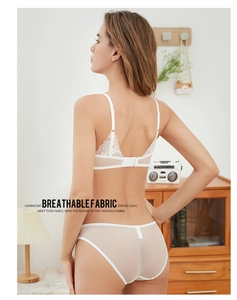Detail of white lace bra set featuring breathable mesh fabric and elegant floral embroidery