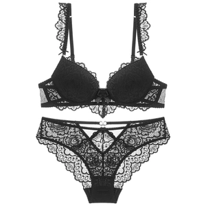 Elegant black lace lingerie set with floral embroidery and bow detail on white background