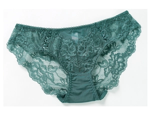 Detail view of dark green floral lace panties with scalloped eyelash edges and mid-waist fit