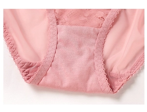 Close-up of pink lace mesh panty with breathable cotton lining and fine stitching detail
