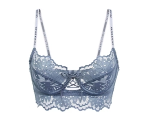 Detailed view of light blue lace bra with Golden Dream lettered straps and bow detail