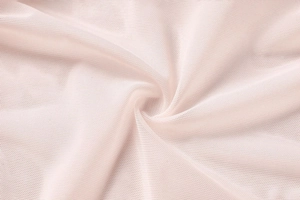Gros plan sur le tissu en dentelle florale rose tendre pour lingerie féminine