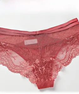 Detail view of dark red lace panties with floral patterns and elastic double strap waist