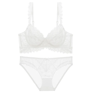 White French lace lingerie set with sheer floral patterns and eyelash trim details