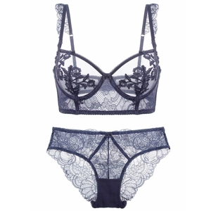 Navy blue lace lingerie set featuring floral embroidery bra and matching panty on white background