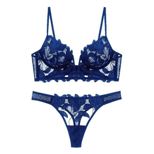 Deep blue French lace lingerie set with floral embroidery and thin straps on white background