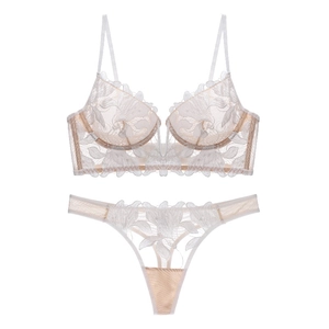 Detailed flat lay of beige deep V floral lace embroidery bra and thong lingerie set