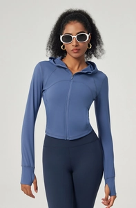 Detail view of hooded yoga jacket showing high-stretch fabric and slim fit design