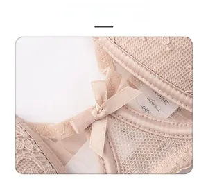 Close-up of nude lace lingerie with bow detail, breathable mesh and fabric wash tag