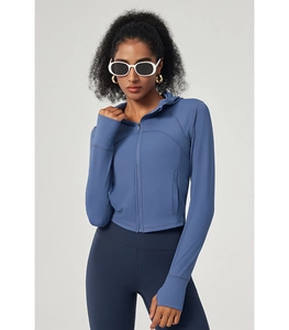 Detail of grey-blue hooded yoga jacket featuring thumbholes and smooth zipper